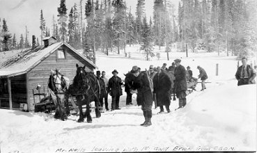First gold bricks produced at the Cariboo Gold Quartz. Leaving with them is Fred Wells (backpack), B. Morgan, and Dr. Burnett at the back-end of the sleigh, wpH337