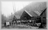 Group of workers in front of mine buildings, wpH109